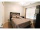 Cozy bedroom with plush carpeting, neutral color palette, and a queen-sized bed with a padded headboard at 416 Line Creek Cir, Sharpsburg, GA 30277