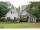 Lovely single-Gathering home with a manicured lawn, stone accents, and mature landscaping at 416 Line Creek Cir, Sharpsburg, GA 30277