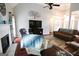 Cozy living room features a fireplace, hardwood floors, and vaulted ceilings at 416 Line Creek Cir, Sharpsburg, GA 30277