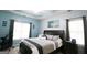 Tranquil main bedroom features a tray ceiling, and large windows at 416 Line Creek Cir, Sharpsburg, GA 30277