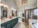 Elegant bathroom with a double vanity and tiled shower at 106 Tullamore Trl, Tyrone, GA 30290