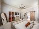 Large main bedroom with a ceiling fan, large window and barn door entry to bathroom at 106 Tullamore Trl, Tyrone, GA 30290
