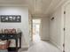 Upstairs hallway with neutral paint and carpet with a view of the playroom at 106 Tullamore Trl, Tyrone, GA 30290