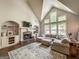 Bright living room with vaulted ceiling and cozy fireplace at 106 Tullamore Trl, Tyrone, GA 30290