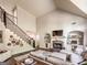 Spacious living room with a fireplace and lots of light at 106 Tullamore Trl, Tyrone, GA 30290