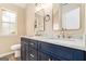Modern bathroom with double vanity, granite countertops, and stylish fixtures at 405 Sherrels Frd, Peachtree City, GA 30269