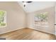 Bright bedroom with vaulted ceilings and large windows offering serene views at 405 Sherrels Frd, Peachtree City, GA 30269