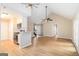 Spacious living room with vaulted ceilings, hardwood floors, and an adjacent kitchen at 405 Sherrels Frd, Peachtree City, GA 30269