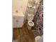 Bathroom featuring toilet, cabinet, and shelving for storage at 5172 Avery Sw St, Covington, GA 30014