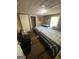 This bedroom features two beds, tv, and access to the bathroom at 5172 Avery Sw St, Covington, GA 30014