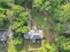 House set amidst lush greenery, presenting a peaceful and secluded environment with natural landscaping at 5045 Rock Springs Rd, Lithonia, GA 30038