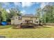 Large backyard with a deck, patio, and plenty of green space, perfect for outdoor activities at 5045 Rock Springs Rd, Lithonia, GA 30038