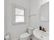 Bathroom features include tile floor, neutral paint, a sink and toilet at 5045 Rock Springs Rd, Lithonia, GA 30038