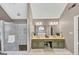 Elegant bathroom featuring a double sink vanity, glass enclosed shower, and marble tile floors at 5045 Rock Springs Rd, Lithonia, GA 30038