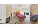 Bright bedroom features charming design elements including custom paint, shelves, and a large window at 5045 Rock Springs Rd, Lithonia, GA 30038