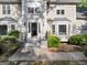 Close up view of the front entrance featuring classic architectural design and manicured landscaping at 5045 Rock Springs Rd, Lithonia, GA 30038