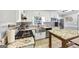 Well-lit kitchen features stainless steel appliances, granite countertops, and wooden island at 5045 Rock Springs Rd, Lithonia, GA 30038