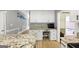 Kitchen featuring granite counters, wooden island, desk area and access to Gathering room at 5045 Rock Springs Rd, Lithonia, GA 30038