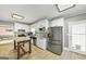 Open kitchen featuring granite counters, stainless appliances, and white cabinetry at 5045 Rock Springs Rd, Lithonia, GA 30038