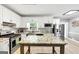 Well-lit kitchen features stainless steel appliances, granite countertops, and wooden island at 5045 Rock Springs Rd, Lithonia, GA 30038
