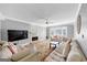 Bright living room with plush seating, decorative fireplace, and large bay window with lots of natural light at 5045 Rock Springs Rd, Lithonia, GA 30038