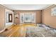 Cozy living room with large windows, hardwood floors, and traditional decor at 5045 Rock Springs Rd, Lithonia, GA 30038
