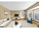 Comfortable living room with hardwood floors, large windows, and stylish furniture at 5045 Rock Springs Rd, Lithonia, GA 30038