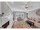 Bright living room with decorative fireplace, and bay window with lots of natural light at 5045 Rock Springs Rd, Lithonia, GA 30038