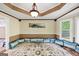 Bright living room featuring large window bay, custom rug, and unique architecture at 5045 Rock Springs Rd, Lithonia, GA 30038