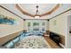 Bright living room featuring large window bay, custom rug, and unique architecture at 5045 Rock Springs Rd, Lithonia, GA 30038