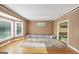 Spacious living area with hardwood floors, a bay window, and serene views of the outside at 5045 Rock Springs Rd, Lithonia, GA 30038