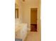 Bathroom featuring a white vanity and neutral tile flooring at 7017 Sun Valley Way, Riverdale, GA 30274