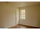 Bedroom with wood-look floors, natural light, and neutral paint at 7017 Sun Valley Way, Riverdale, GA 30274