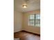 Bedroom with window and wood-look laminate flooring at 7017 Sun Valley Way, Riverdale, GA 30274
