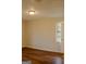 Cozy bedroom with wood-look laminate flooring and lots of natural light at 7017 Sun Valley Way, Riverdale, GA 30274