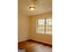 Cozy bedroom featuring a window that fills the room with natural light and vinyl floors at 7017 Sun Valley Way, Riverdale, GA 30274