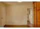 Neutral-toned room with wood-look vinyl floors and a view into the laundry room at 7017 Sun Valley Way, Riverdale, GA 30274