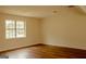 Bright, spacious living room with natural light and wood-look floors at 7017 Sun Valley Way, Riverdale, GA 30274