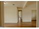 Spacious, light-filled living room showcasing laminate floors and freshly painted walls at 7017 Sun Valley Way, Riverdale, GA 30274