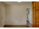 Spacious room with wood-look laminate floors, and access to utility room at 7017 Sun Valley Way, Riverdale, GA 30274