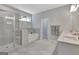 Well-lit bathroom featuring a glass shower and a separate tub at 221 Caledonia Ct, Peachtree City, GA 30269