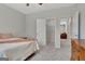 Bedroom with gray walls, carpeted floor, walk-in closet, and a doorway to another room at 221 Caledonia Ct, Peachtree City, GA 30269