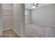 Walk-in closet featuring wire shelving and a view of the bedroom at 221 Caledonia Ct, Peachtree City, GA 30269