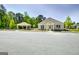 Community clubhouse with ample parking and a charming covered area for socializing at 221 Caledonia Ct, Peachtree City, GA 30269