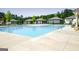 Large community pool with a concrete patio, perfect for relaxation and recreation at 221 Caledonia Ct, Peachtree City, GA 30269