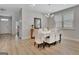Dining room features natural light, seating for six, and flows into other rooms at 221 Caledonia Ct, Peachtree City, GA 30269