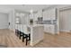 Bright kitchen features a large island with seating and modern stainless steel appliances at 221 Caledonia Ct, Peachtree City, GA 30269