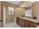 Bathroom featuring double sink vanity, ample lighting and neutral paint at 333 Old Carrollton Rd, Roopville, GA 30170