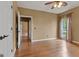 Spacious bedroom featuring hardwood floors, tan walls, ceiling fan, and plenty of natural light at 333 Old Carrollton Rd, Roopville, GA 30170
