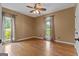 Empty bedroom featuring hardwood floors, natural light, ceiling fan, and neutral paint at 333 Old Carrollton Rd, Roopville, GA 30170